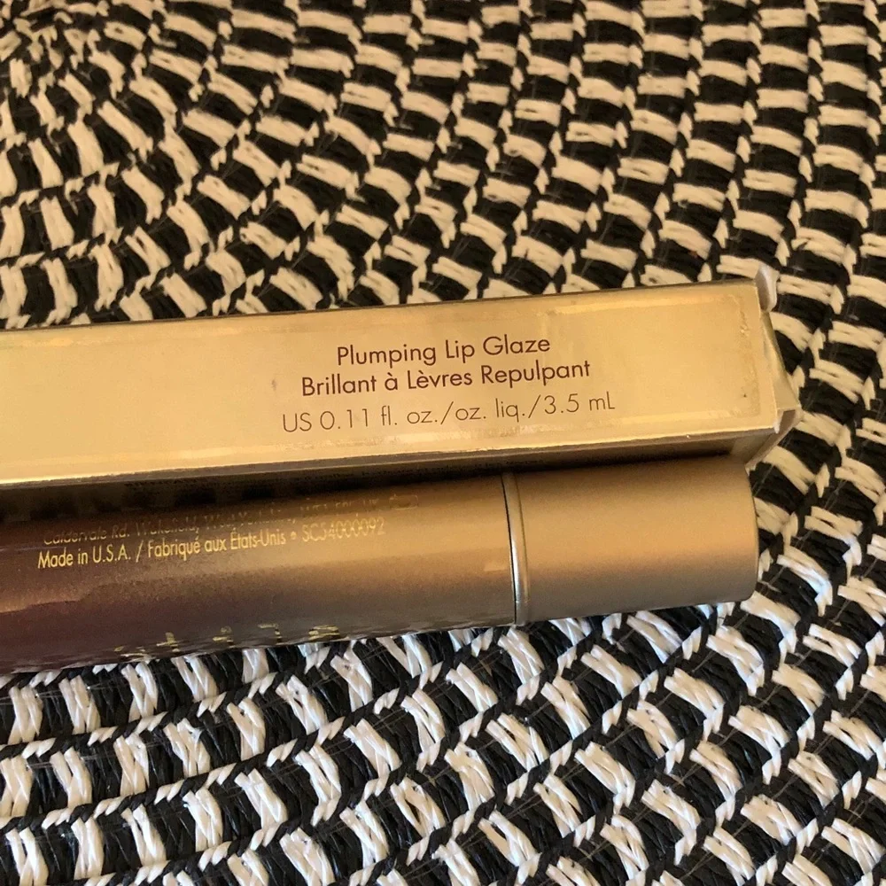 NWOT in box. Stila plumping Lip glaze. High shine formula. Color is Maple.